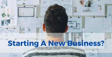 An entrepreneur viewing a wall of plans for their new business venture and ideas. Text: Starting A New Business?